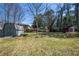 A well-sized backyard with mature trees and a storage shed at 264 Silver Springs Sw Cir, Atlanta, GA 30310