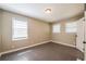 Bedroom featuring neutral walls, wood-look floors, and bright windows at 264 Silver Springs Sw Cir, Atlanta, GA 30310