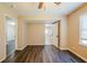 Bright bedroom featuring wood-look flooring, neutral walls, and an ensuite bathroom at 264 Silver Springs Sw Cir, Atlanta, GA 30310