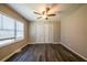 Bedroom featuring a ceiling fan, closet, and a window at 264 Silver Springs Sw Cir, Atlanta, GA 30310