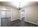 Hardwood floors in the dining room with chandelier at 264 Silver Springs Sw Cir, Atlanta, GA 30310