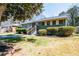 Single-story home featuring a recently painted exterior, an inviting entrance, and a well-maintained lawn at 264 Silver Springs Sw Cir, Atlanta, GA 30310