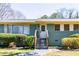 Charming single-story home with a freshly painted exterior, inviting entrance, and manicured front yard at 264 Silver Springs Sw Cir, Atlanta, GA 30310