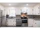 Modern kitchen with stainless appliances and tiled backsplash at 264 Silver Springs Sw Cir, Atlanta, GA 30310