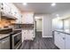 Kitchen with granite countertops, tiled backsplash, and stainless steel appliances at 264 Silver Springs Sw Cir, Atlanta, GA 30310