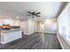 Open-concept living space features gray flooring, recessed lighting, and an updated kitchen with stainless appliances at 264 Silver Springs Sw Cir, Atlanta, GA 30310