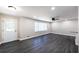 Bright and spacious living room with recessed lighting, new flooring, a modern ceiling fan, and a front door at 264 Silver Springs Sw Cir, Atlanta, GA 30310