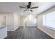 Bright, open living room with ceiling fan and large window overlooking the yard at 264 Silver Springs Sw Cir, Atlanta, GA 30310