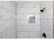 Tiled shower with modern fixtures and a tiled cubby hole at 264 Silver Springs Sw Cir, Atlanta, GA 30310
