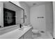 Modern bathroom with sleek fixtures, black and white tile, and a vanity with plenty of counter space at 2887 Hickory Ln, Snellville, GA 30078