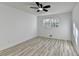 Comfortable bedroom with a ceiling fan, hardwood floors, and natural light at 2887 Hickory Ln, Snellville, GA 30078