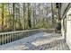 Back deck with railing, gray wood and view of trees at 2887 Hickory Ln, Snellville, GA 30078