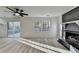 Cozy living room with hardwood floors, a fireplace, and a sliding glass door to the backyard deck at 2887 Hickory Ln, Snellville, GA 30078