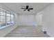 Bright living room with hardwood flooring and a large window offering natural light at 2887 Hickory Ln, Snellville, GA 30078