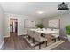 Elegant dining room featuring a modern table setting, plank floors, and natural lighting at 4089 Lindsey Dr, Decatur, GA 30035