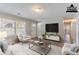 Bright living room with neutral decor, large windows, and modern furniture arrangement at 4089 Lindsey Dr, Decatur, GA 30035