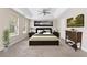 Bedroom featuring tray ceiling, ceiling fan, and dark wood furnishings at 1125 Reunion Sw Pl, Atlanta, GA 30331