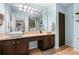 Bathroom featuring dual vanity sinks with cabinetry and a framed mirror at 1401 Keys Crossing Ne Dr, Atlanta, GA 30319