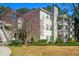 Three-story condo building with multiple balconies and charming landscaping at 1401 Keys Crossing Ne Dr, Atlanta, GA 30319