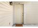 Front door to unit #1401 with paneled siding at 1401 Keys Crossing Ne Dr, Atlanta, GA 30319