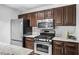 Modern kitchen featuring stainless steel appliances and granite countertops at 1401 Keys Crossing Ne Dr, Atlanta, GA 30319