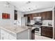 Well-lit kitchen with stainless steel appliances and dark cabinetry at 1401 Keys Crossing Ne Dr, Atlanta, GA 30319