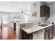 Open-concept kitchen featuring granite countertops with stainless steel dishwasher at 1401 Keys Crossing Ne Dr, Atlanta, GA 30319