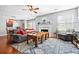 Cozy living room featuring a fireplace, ceiling fan, and hardwood flooring at 1401 Keys Crossing Ne Dr, Atlanta, GA 30319