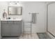 Modern bathroom featuring a vanity with gray cabinets and a glass-enclosed shower at 557 Stone Field Nw Run, Marietta, GA 30060