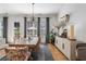 Elegant dining room with hardwood floors and a modern chandelier at 557 Stone Field Nw Run, Marietta, GA 30060