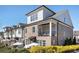 Beautiful brick townhome with balconies, patio, and manicured landscaping at 557 Stone Field Nw Run, Marietta, GA 30060