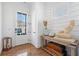 Bright foyer featuring wood floors, natural light, and an accent table at 557 Stone Field Nw Run, Marietta, GA 30060