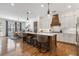 Open kitchen with a large island, modern lighting, and stainless steel appliances at 557 Stone Field Nw Run, Marietta, GA 30060