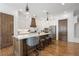 Gourmet kitchen with an island, pendant lighting, and custom cabinetry at 557 Stone Field Nw Run, Marietta, GA 30060