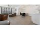 Open-concept living room with a comfortable gray sectional sofa, dining area, and convenient kitchenette at 557 Stone Field Nw Run, Marietta, GA 30060
