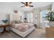 Serene main bedroom with a tufted headboard, soft lighting, and elegant decor at 557 Stone Field Nw Run, Marietta, GA 30060