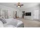 Bright primary bedroom with ensuite bathroom access, plush carpet and neutral color scheme at 557 Stone Field Nw Run, Marietta, GA 30060