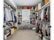 Well-organized walk-in closet with ample shelving, hanging space, and natural light at 557 Stone Field Nw Run, Marietta, GA 30060