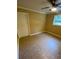 Bedroom featuring tile floors, natural light from the window and a ceiling fan at 615 Woodruff Rd, Carrollton, GA 30116