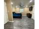 Bedroom featuring vinyl floors and a mounted television at 615 Woodruff Rd, Carrollton, GA 30116