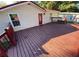 Beautiful wooden deck with bench and red door at 615 Woodruff Rd, Carrollton, GA 30116