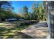 This is a view of the long concrete driveway that leads to the home and detached garage at 615 Woodruff Rd, Carrollton, GA 30116