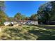 Exterior view of the house from the backyard, highlighting the green grass at 615 Woodruff Rd, Carrollton, GA 30116