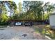 Parking featuring two vehicles parked inside a fenced in pavilion at 615 Woodruff Rd, Carrollton, GA 30116