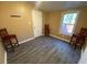 Room with wood flooring and natural light from the window at 615 Woodruff Rd, Carrollton, GA 30116