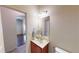 Compact powder room with a single sink vanity and a toilet, conveniently located off the main living area at 2409 Brynfield Cv, Suwanee, GA 30024