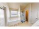 Bathroom featuring tub, shower, and separate toilet area for added convenience at 2409 Brynfield Cv, Suwanee, GA 30024