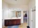 Spacious bathroom featuring a double vanity and an open doorway to the main bedroom at 2409 Brynfield Cv, Suwanee, GA 30024