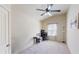 Bedroom with neutral carpeting, ceiling fan, and a bright window area at 2409 Brynfield Cv, Suwanee, GA 30024