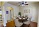 Elegant dining room featuring hardwood floors and stylish decor with seating for six at 2409 Brynfield Cv, Suwanee, GA 30024